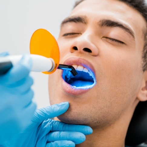 Dental patient receiving cosmetic dental bonding