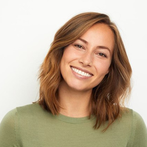 a patient smiling after receiving cosmetic dentistry