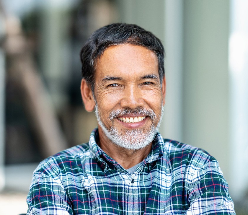Man smiling with dental crown in Brookfield
