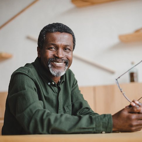 a man in Brookfield smiling with new dentures