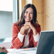 Woman sitting at a desk and smiling