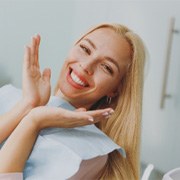 Patient with blonde hair smiling before dental checkup