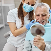 An aging gentleman happy with his dental implants