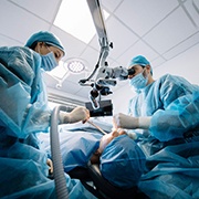 A team of dentists finishing a dental implant surgery