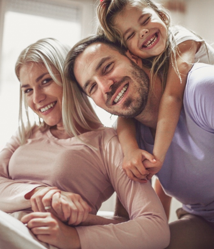 Smiling parents and child