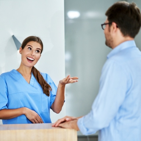 Dental team member explaining how dental insurance works