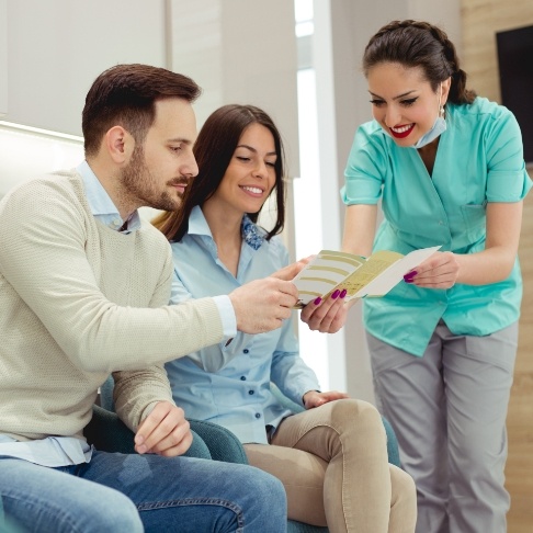 Dental team member discussing dental insurance coverage