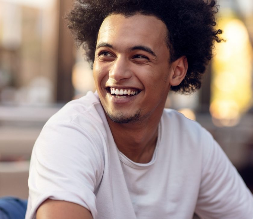 Man with healthy smile after gum disease treatment