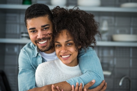 Man and woman with gorgeous smiles after cosmetic dentistry
