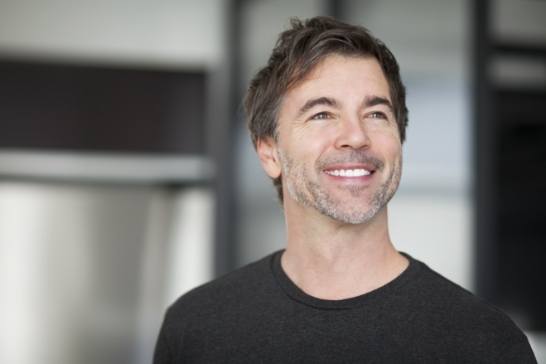 Man with healthy smile after gum disease treatment