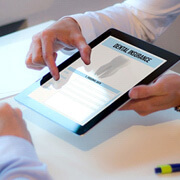 a patient reviewing dnetal insurance with an insurance agent