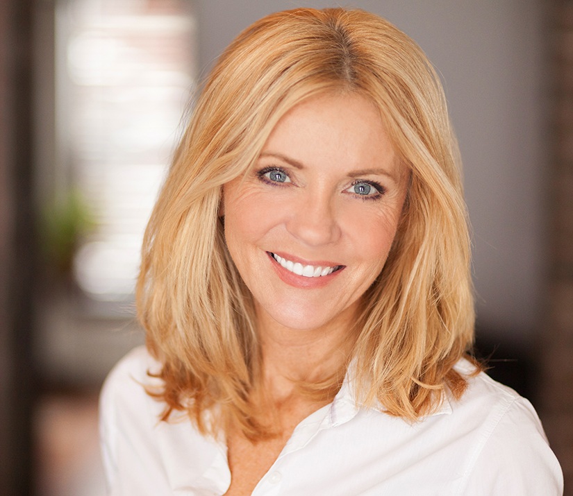 A mature, smiling woman