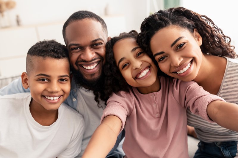 A family smiling for a portrait